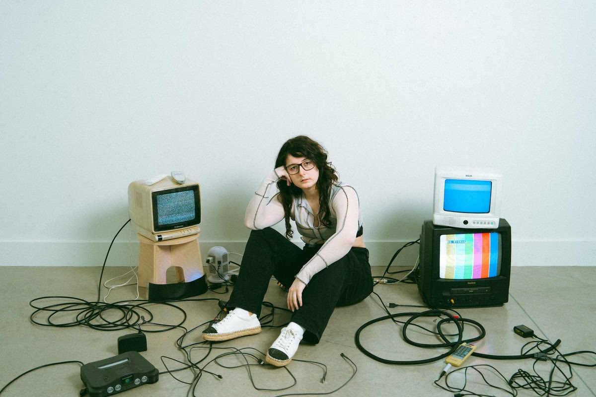 Madds Buckley’s ‘A Simple Binary And A Complex Phrase’ Explores The Isolation And Burnout Of The Digital Age